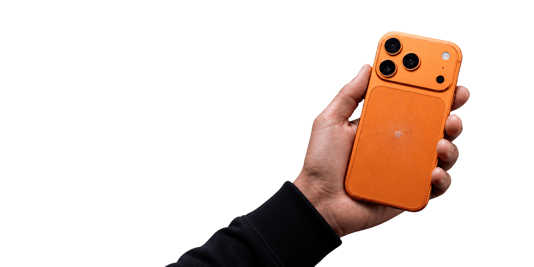 An orange iPhone 17 Pro with cracked rear glass held carefully in a hand